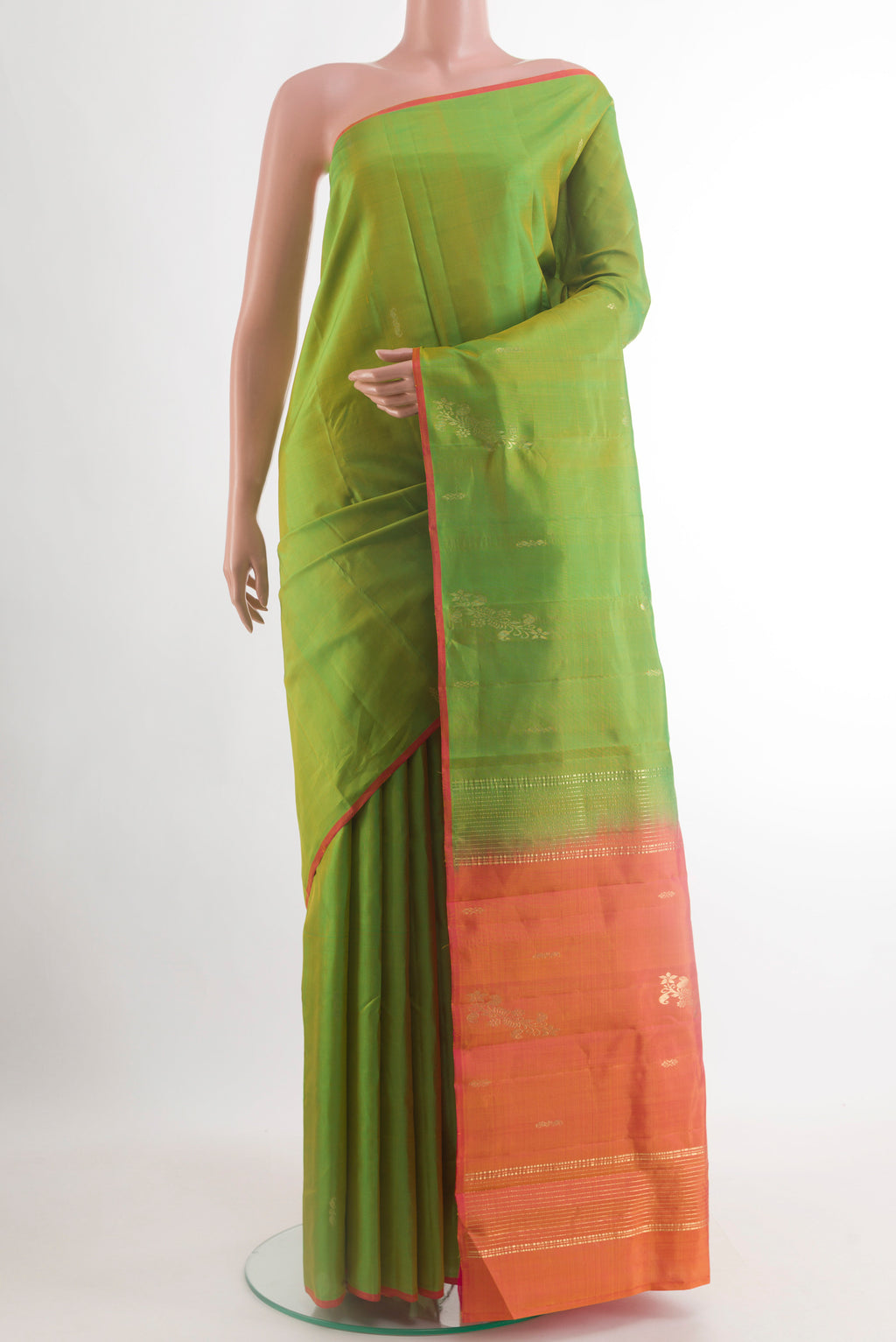 Green Kanchipuram Silk Saree with Zari Butta on the body and Plain Border.  displayed on a mannequin