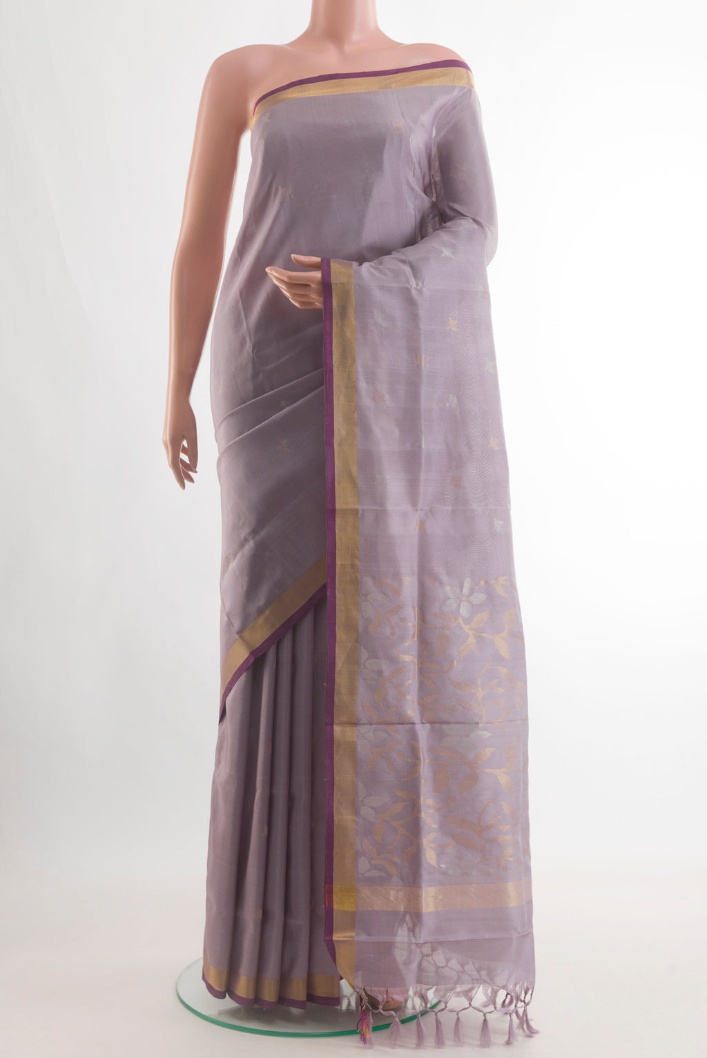 Lilac Uppada Silk Saree with Zari Butta on the body and Zari Border.  displayed on a mannequin