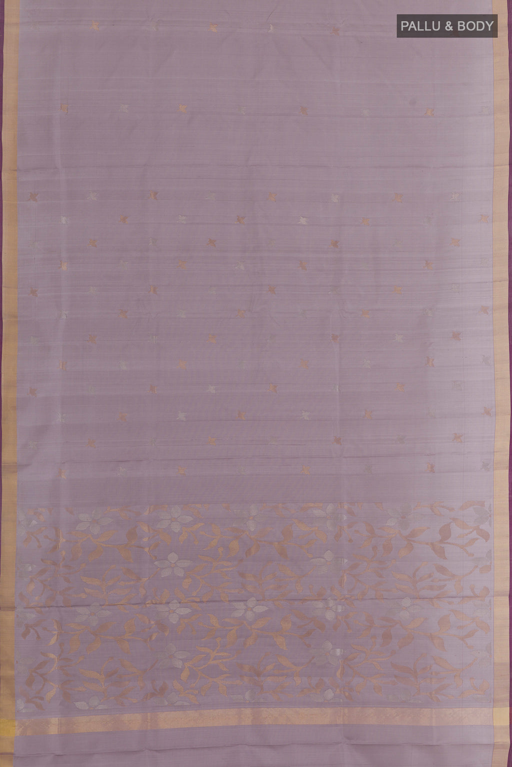 Flat view of Lilac Uppada Silk Saree with Zari Butta on the body and Zari Border. 
