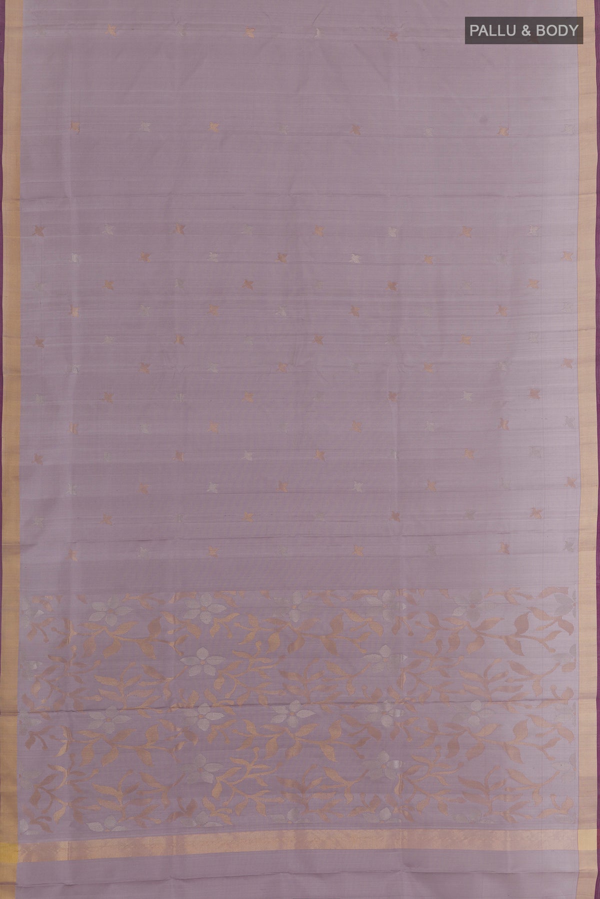 Flat view of Lilac Uppada Silk Saree with Zari Butta on the body and Zari Border. 