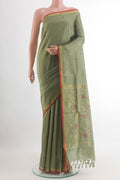 Sage Green Uppada Silk Saree with Zari Butta on the body and Zari Border.  displayed on a mannequin
