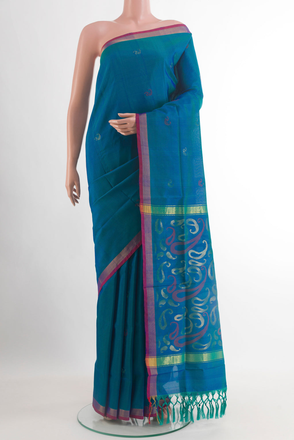 Peacock Blue Uppada Silk Saree with Zari Butta on the body and Zari Border.  displayed on a mannequin