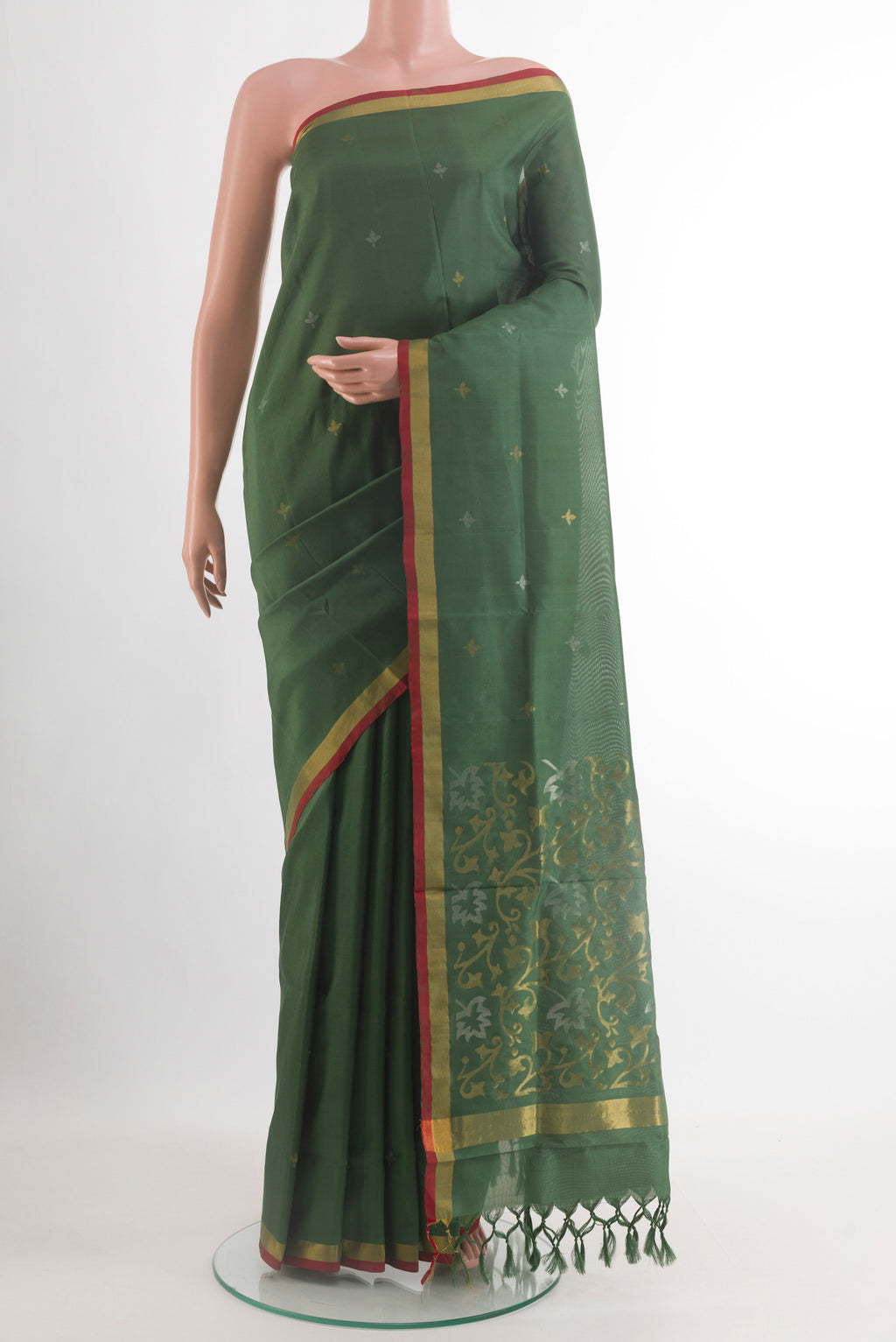 Bottle Green Uppada Silk Saree with Zari Butta on the body and Zari Border.  displayed on a mannequin