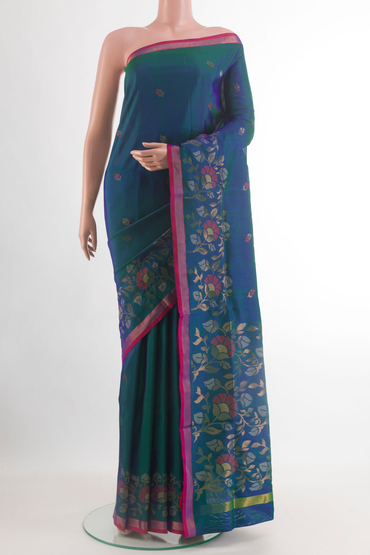 Peacock Blue Uppada Silk Saree with Zari Butta on the body and Zari Border.  displayed on a mannequin