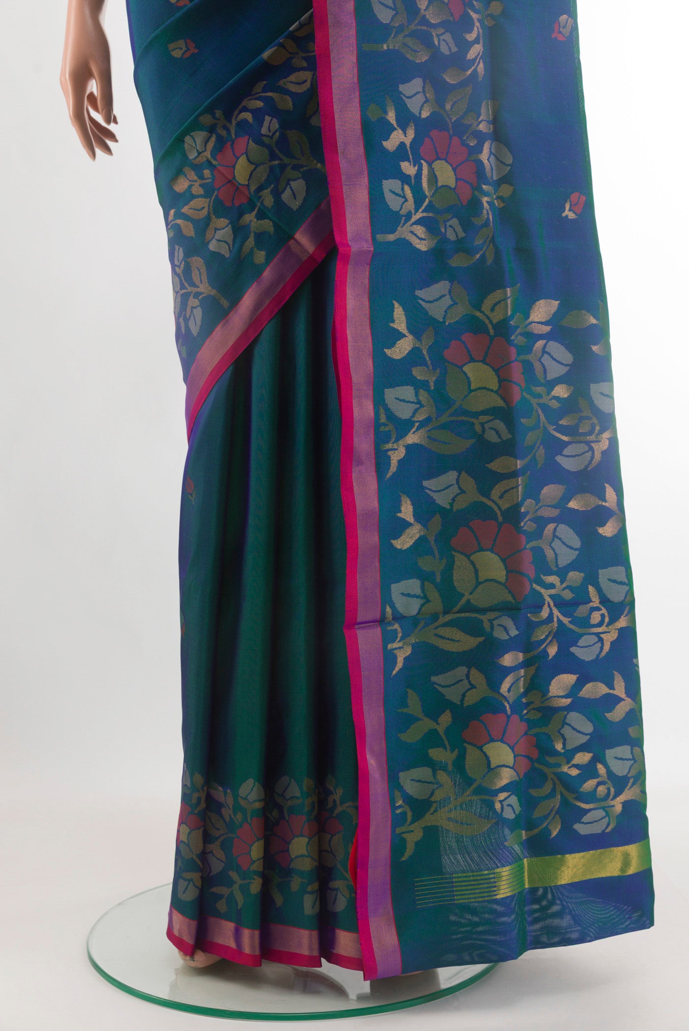Pleats and pallu of Peacock Blue Uppada Silk Saree with Zari Butta on the body and Zari Border. 