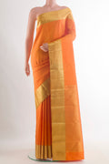 Pure Silk Orange Kanjivaram Saree with Plain Body and Zari Border.  displayed on a mannequin