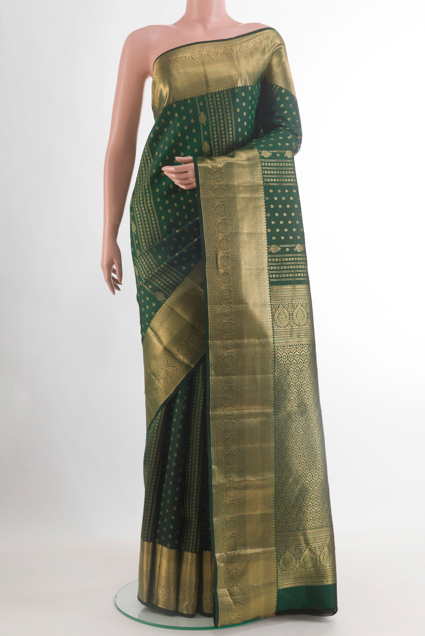Bottle Green Kanchipuram Silk Saree with Zari Brocade on the body and Zari Border.  displayed on a mannequin