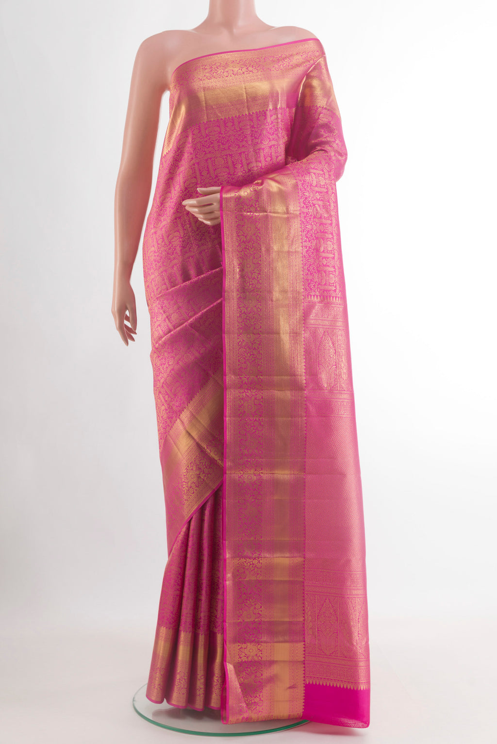 Pink Kanchipuram Silk Saree with Zari Brocade on the body and Zari Border.  displayed on a mannequin
