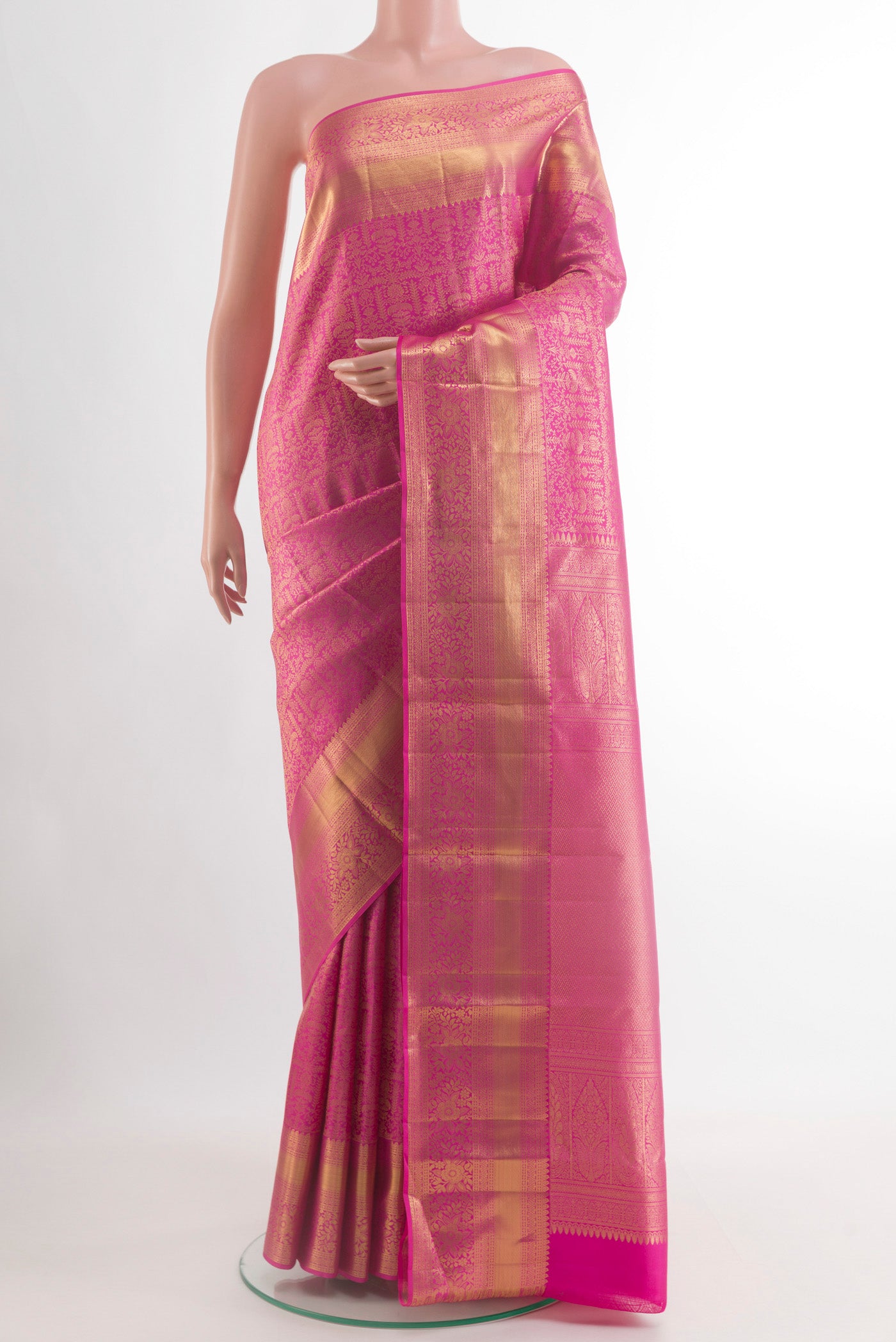 Pink Kanchipuram Silk Saree with Zari Brocade on the body and Zari Border.  displayed on a mannequin