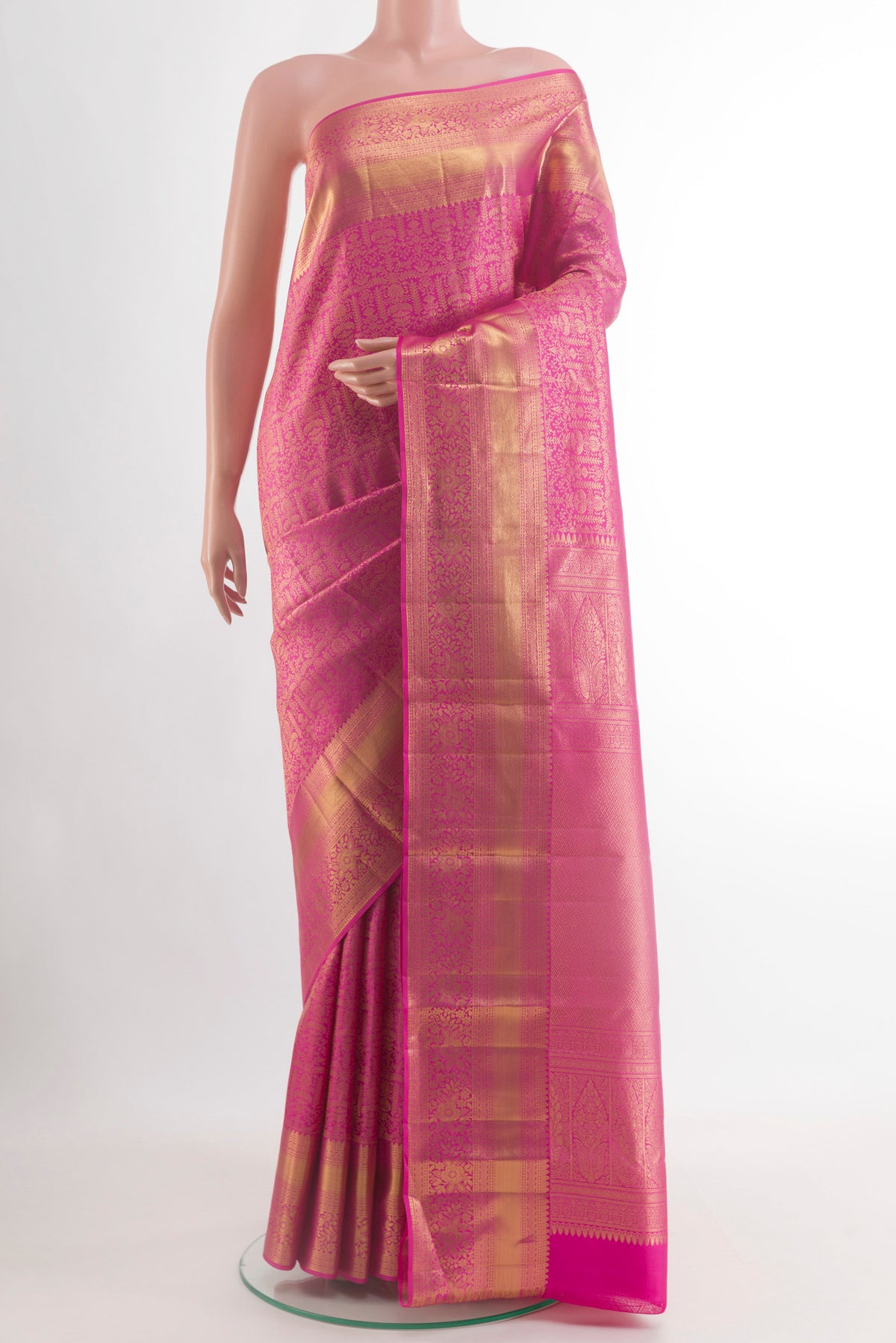 Pink Kanchipuram Silk Saree with Zari Brocade on the body and Zari Border.  displayed on a mannequin