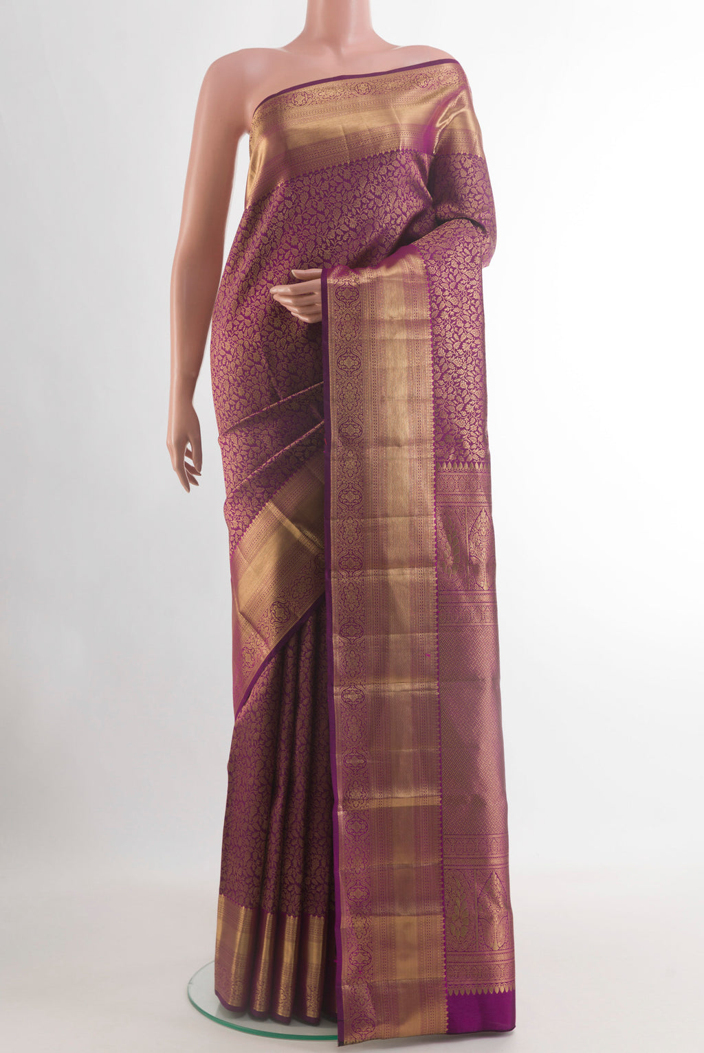 Purple Kanchipuram Silk Saree with Zari Brocade on the body and Zari Border.  displayed on a mannequin