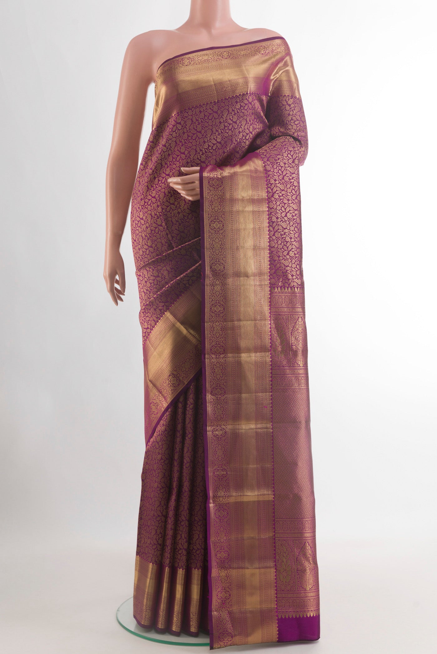 Purple Kanchipuram Silk Saree with Zari Brocade on the body and Zari Border.  displayed on a mannequin