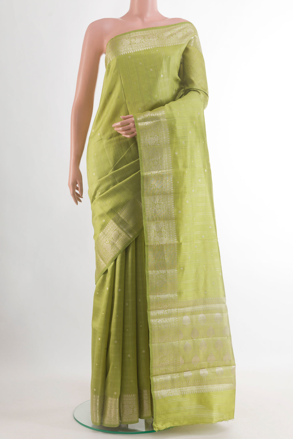 Green Banarasi Raw Silk Saree with Zari Brocade on the body and Zari Border.  displayed on a mannequin
