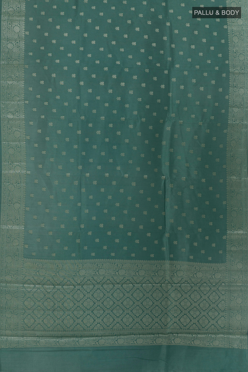 Flat view of Sage Green Banarasi Raw Silk Saree with Zari Butta on the body and Zari Border. 