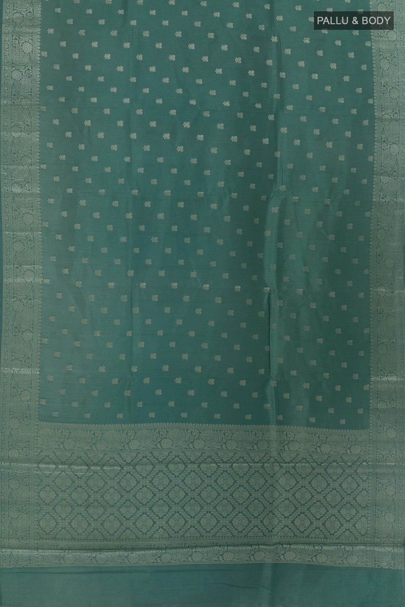 Flat view of Sage Green Banarasi Raw Silk Saree with Zari Butta on the body and Zari Border. 