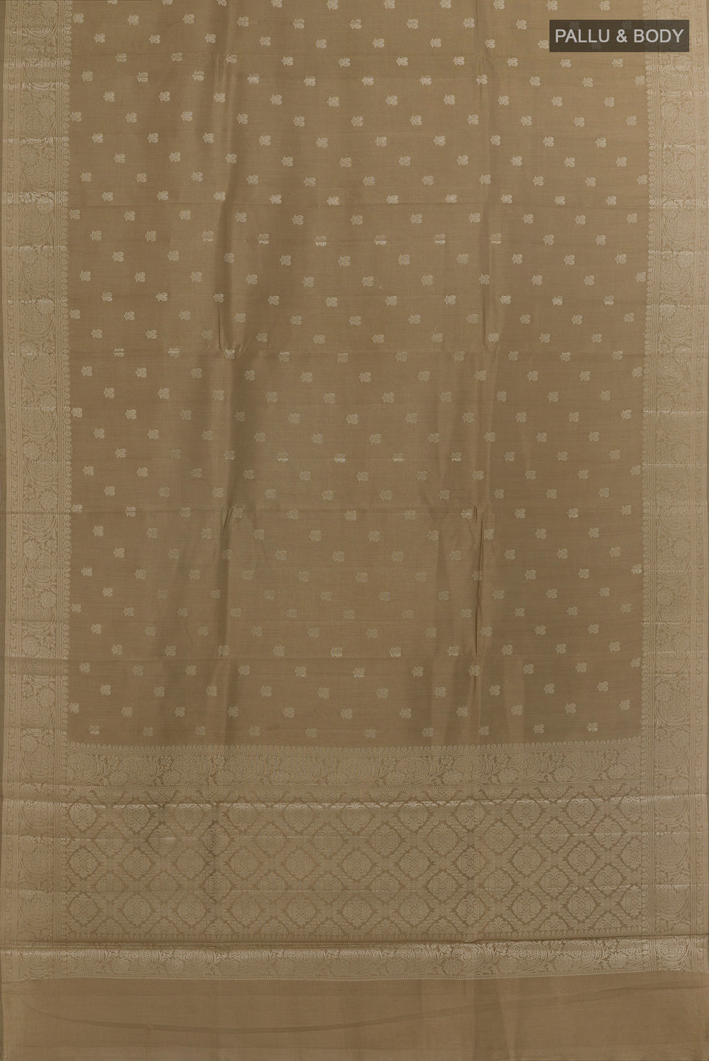 Flat view of Beige Banarasi Raw Silk Saree with Zari Butta on the body and Zari Border. 