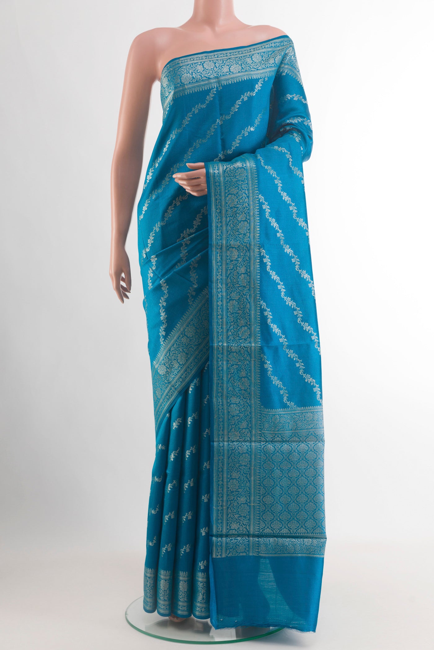 Blue Tussar Silk Saree with Zari Brocade on the body and Zari Border.  displayed on a mannequin