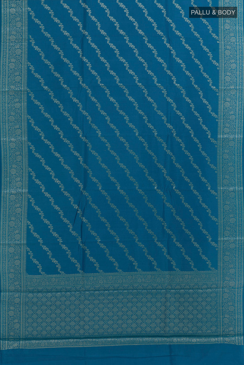 Flat view of Blue Tussar Silk Saree with Zari Brocade on the body and Zari Border. 