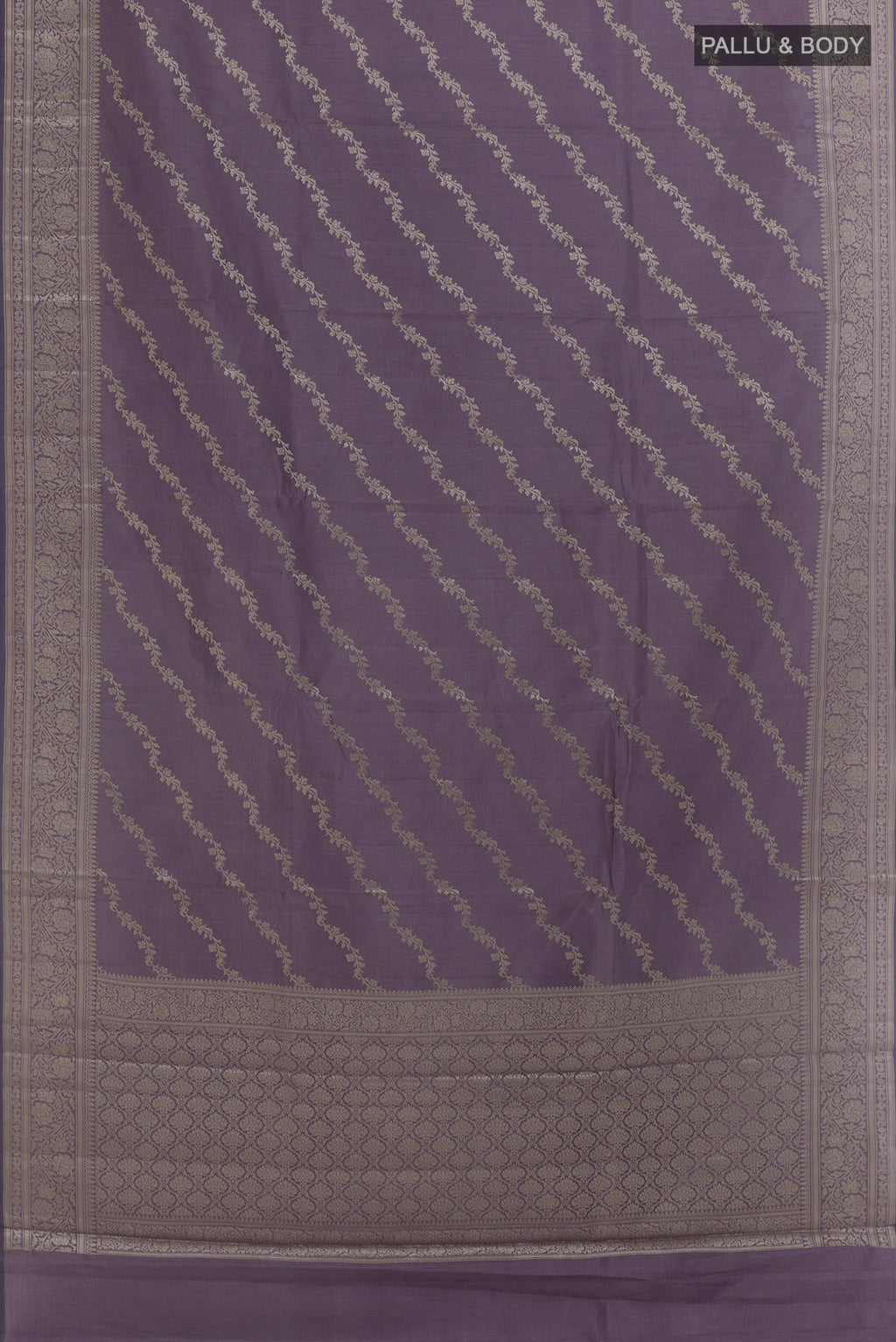 Flat view of Lilac Banarasi Raw Silk Saree with Zari Brocade on the body and Zari Border. 