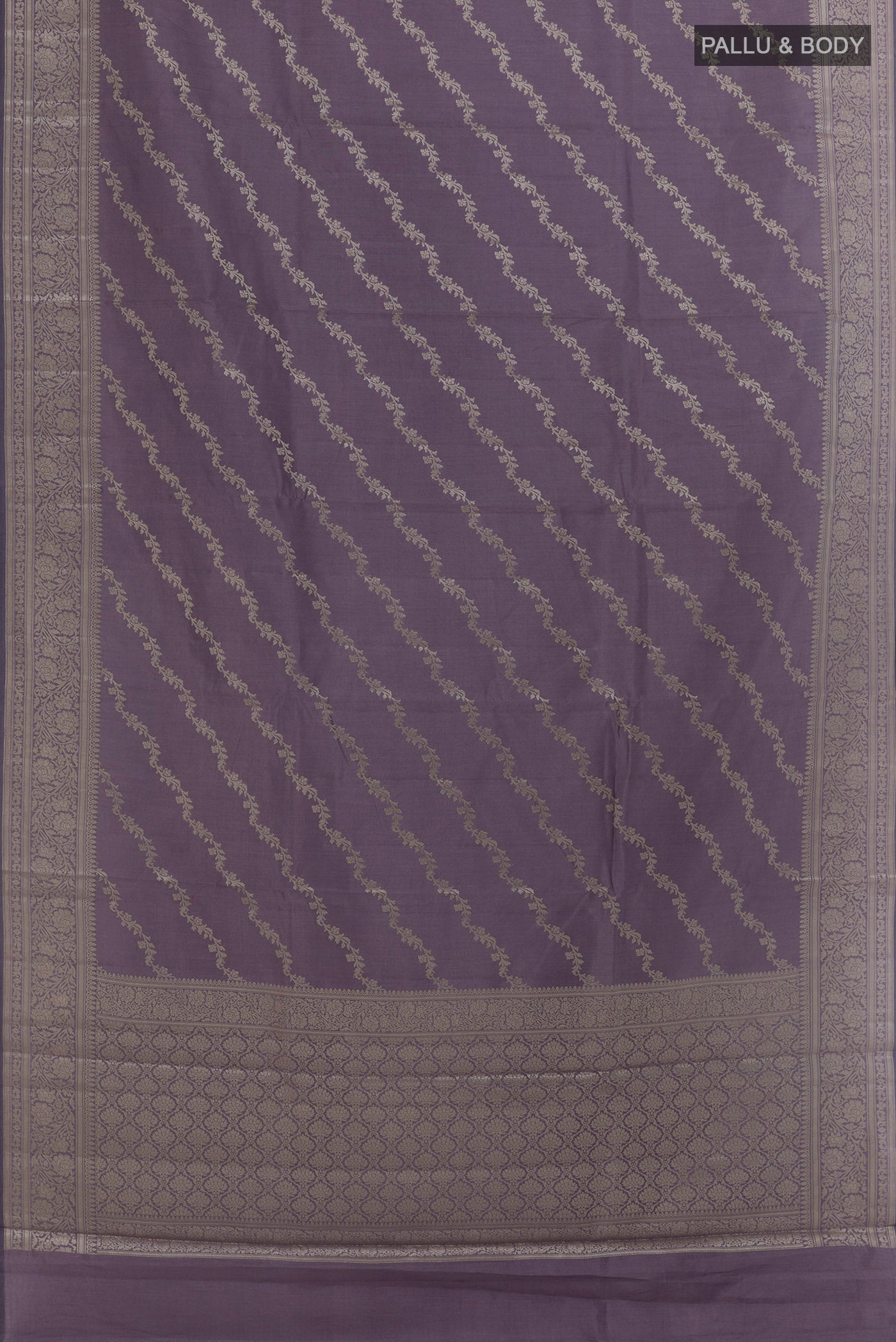 Flat view of Lilac Banarasi Raw Silk Saree with Zari Brocade on the body and Zari Border. 