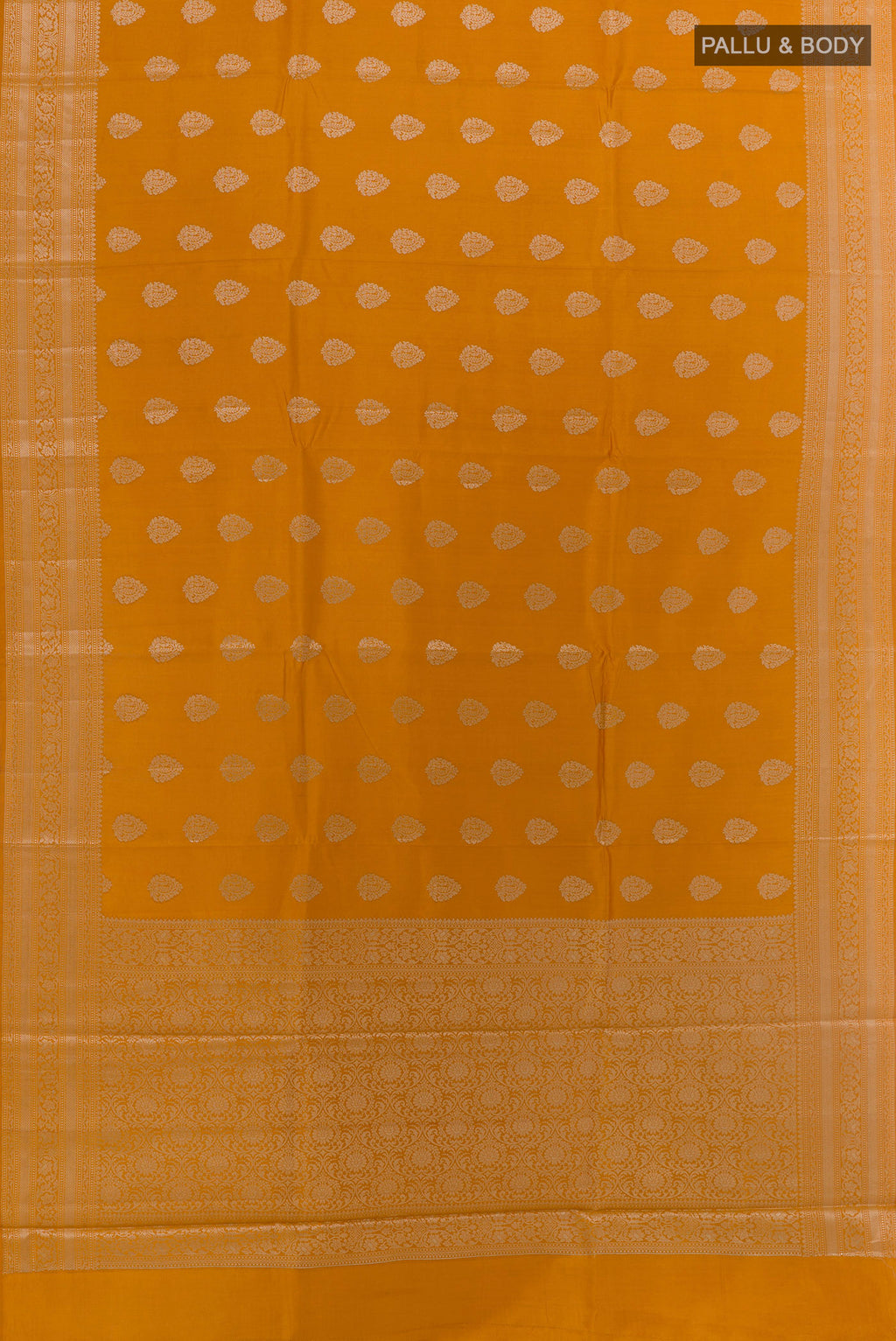 Flat view of Mustard Banarasi Raw Silk Saree with Zari Butta on the body and Zari Border. 