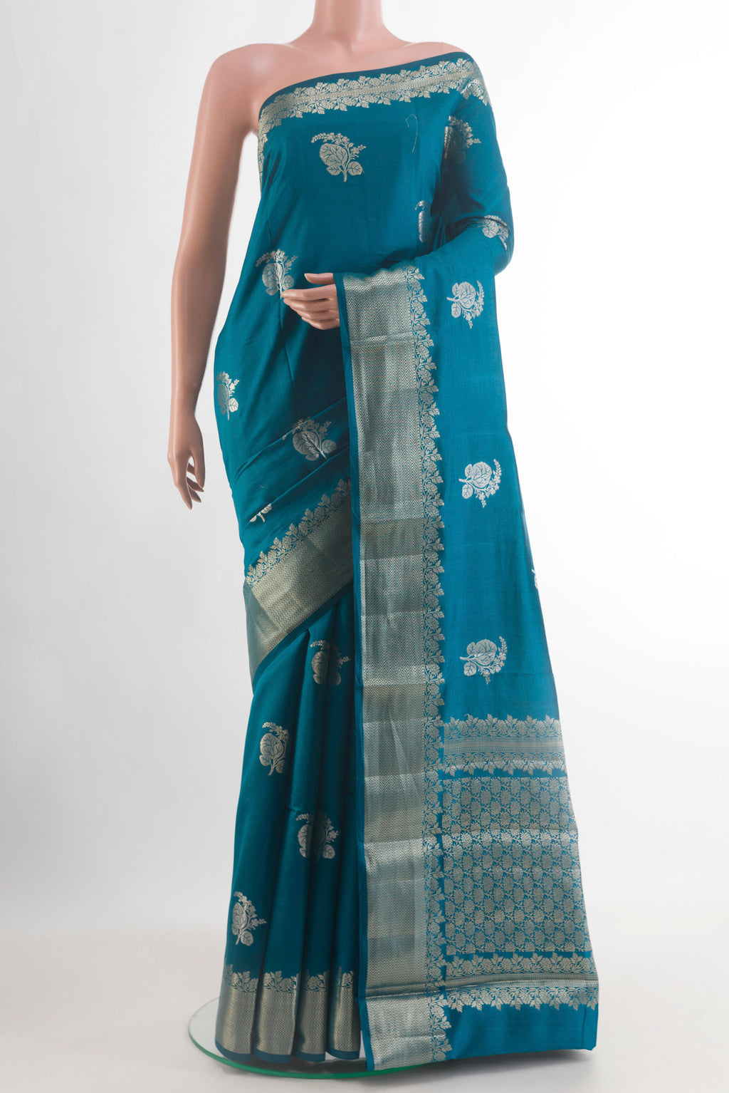Blue Banarasi Raw Silk Saree with Zari Butta on the body and Zari Border.  displayed on a mannequin