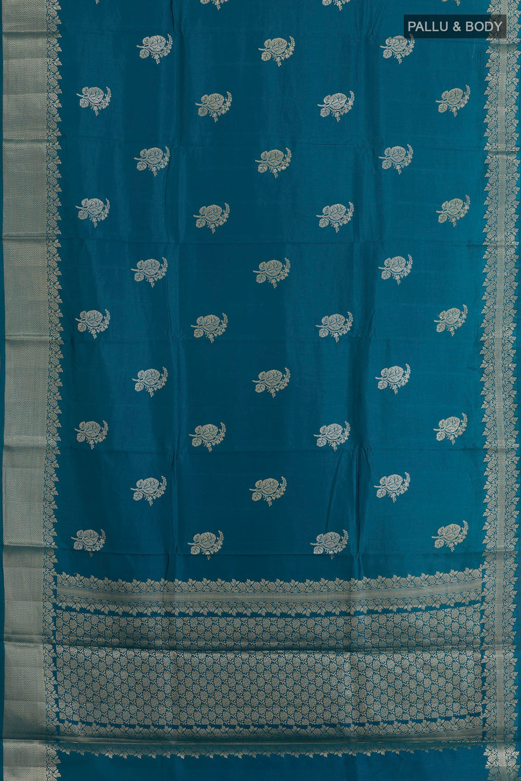 Flat view of Blue Banarasi Raw Silk Saree with Zari Butta on the body and Zari Border. 