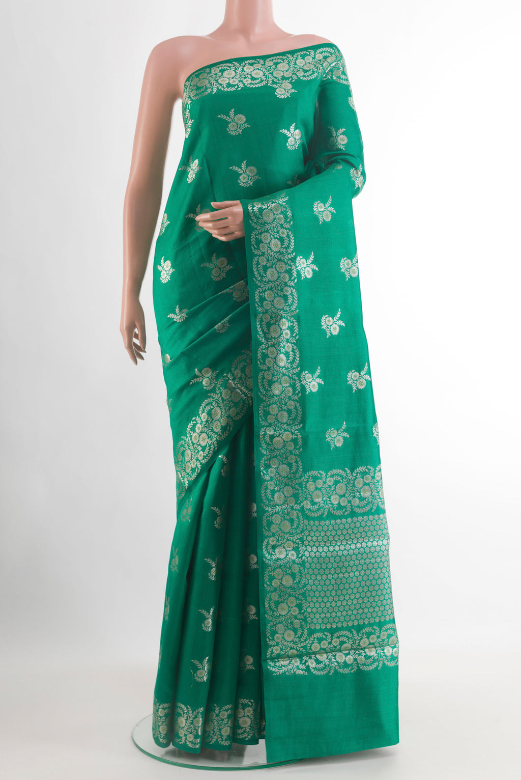 Green Banarasi Silk Saree with Zari Butta on the body and Zari Border.  displayed on a mannequin