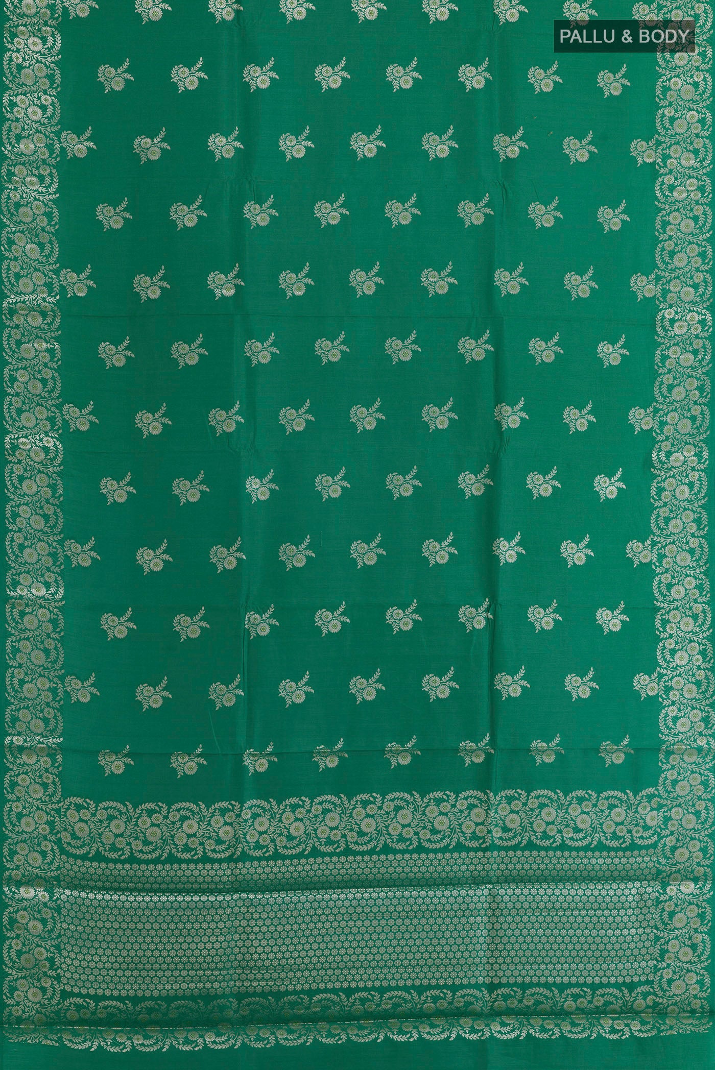 Flat view of Green Banarasi Silk Saree with Zari Butta on the body and Zari Border. 