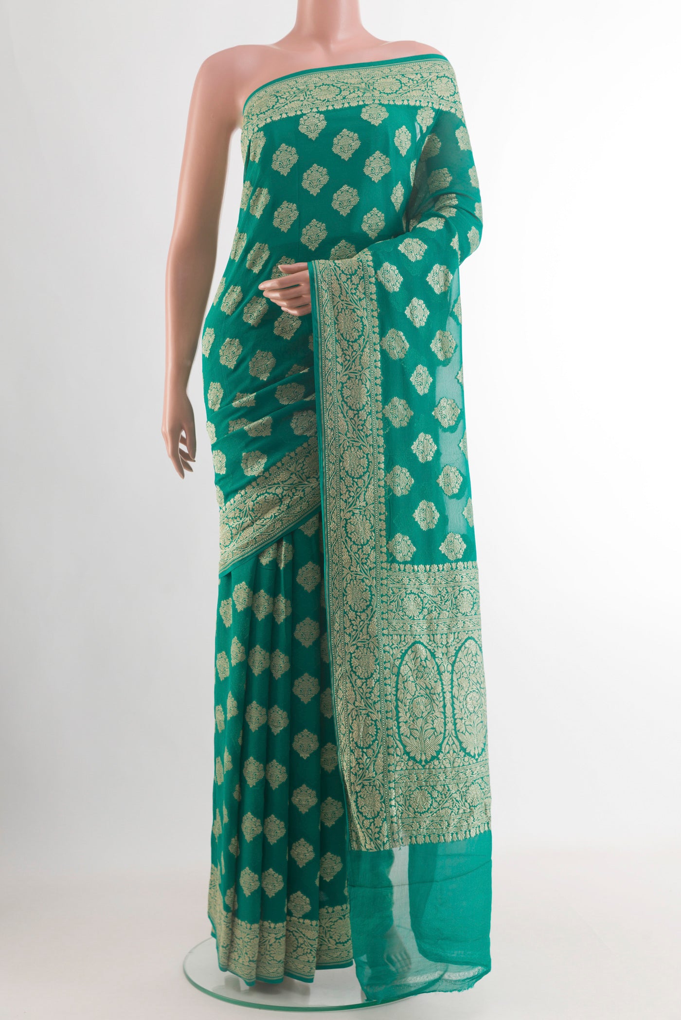 Sea Green Banarasi Georgette Saree with Zari Brocade on the body and Zari Border.  displayed on a mannequin