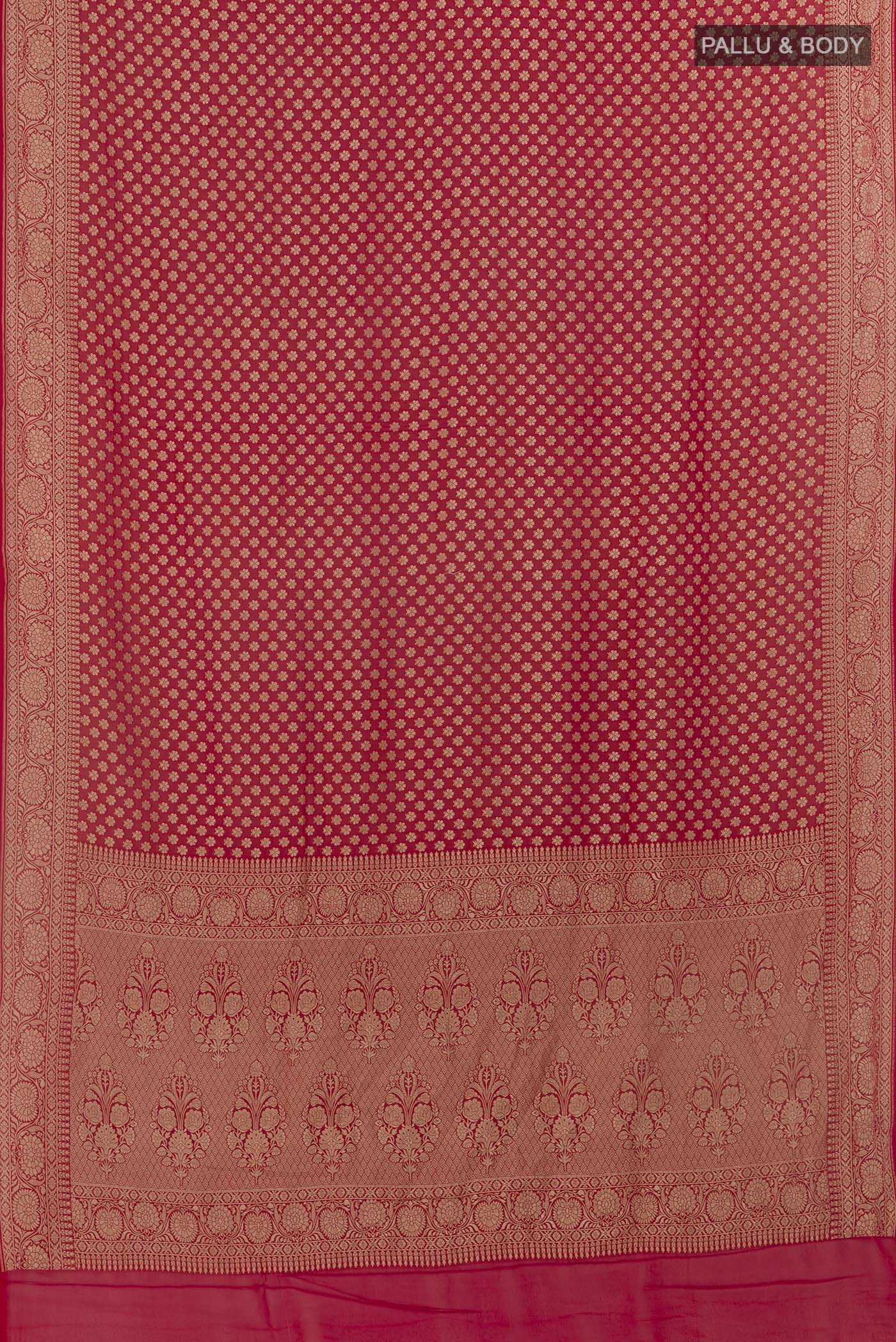 Flat view of Red Banarasi Georgette Saree with Zari Butta on the body and Zari Border. 