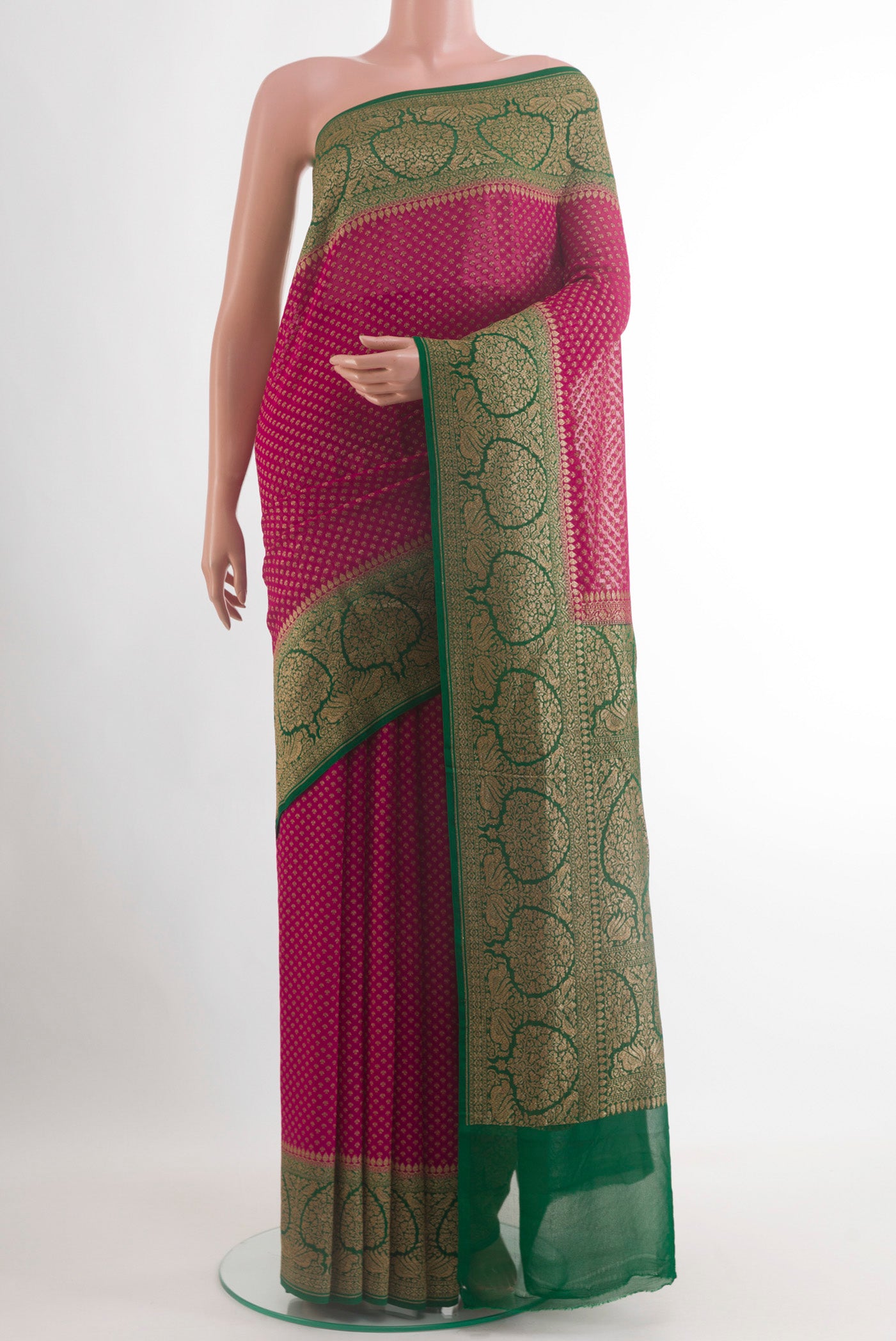 Pink Banarasi Georgette Saree with Zari Butta on the body and Zari Border.  displayed on a mannequin