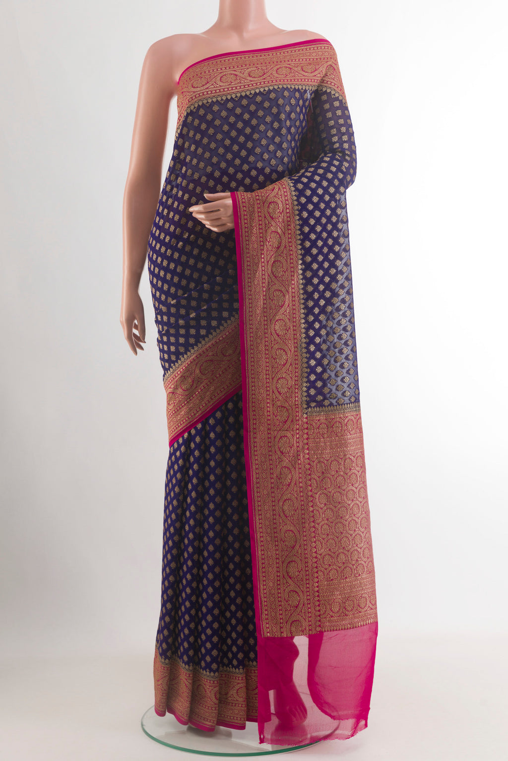 Navy Blue Banarasi Georgette Saree with Zari Brocade on the body and Zari Border.  displayed on a mannequin
