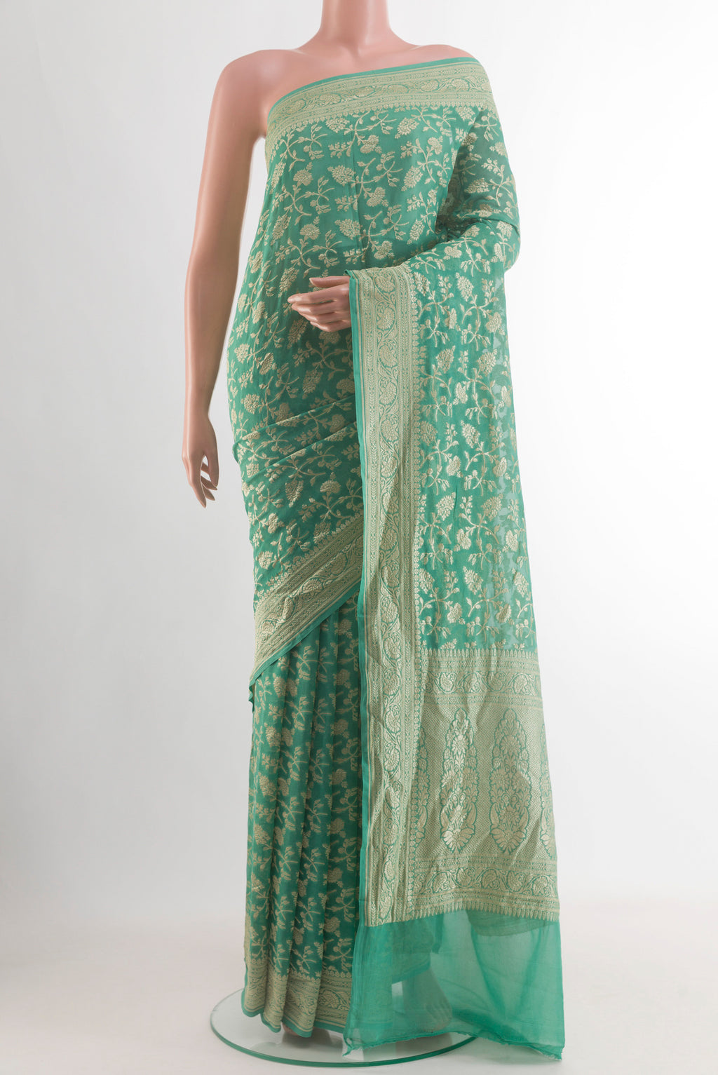 Turquoise Banarasi Georgette Saree with Zari Brocade on the body and Zari Border.  displayed on a mannequin
