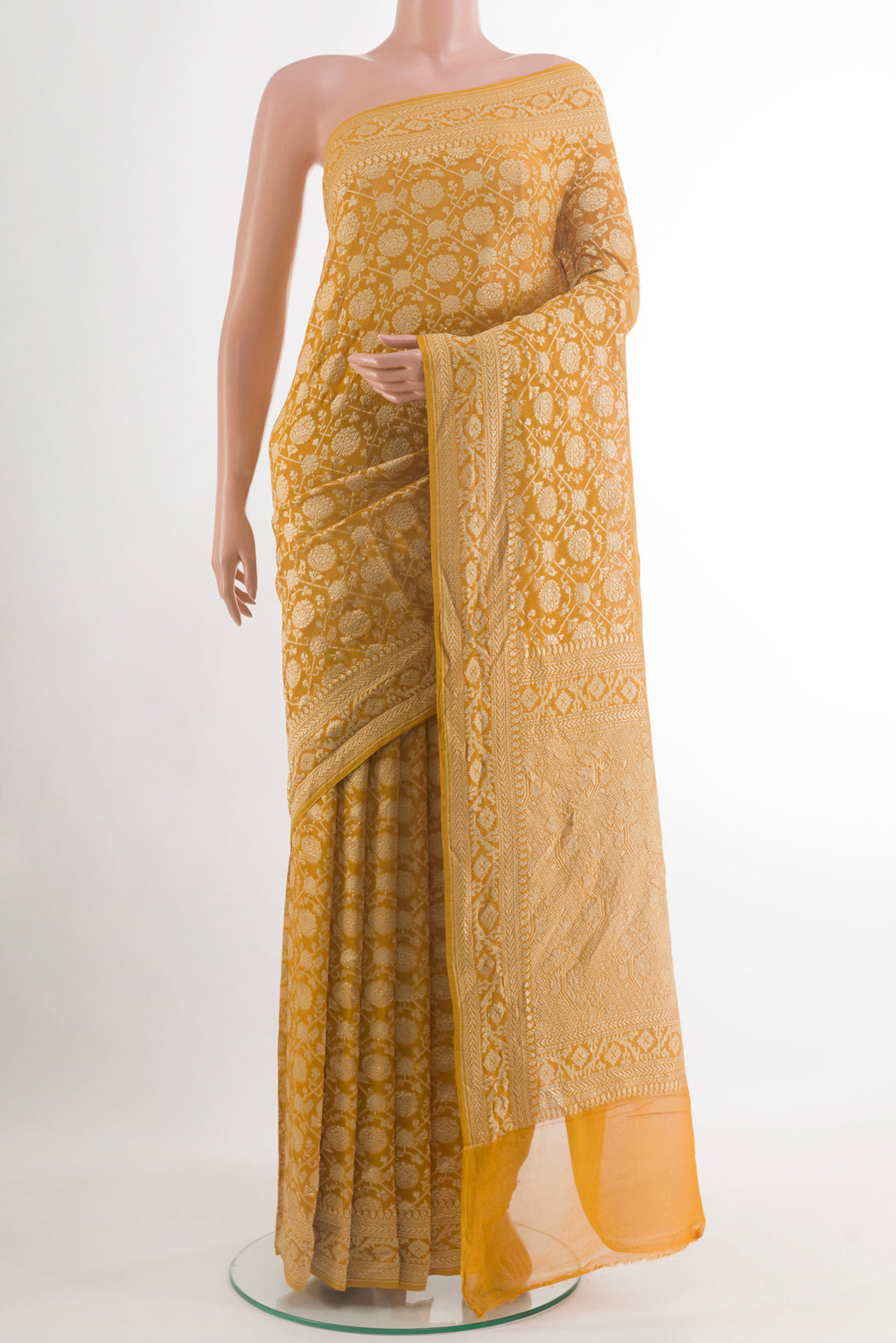 Yellow Banarasi Georgette Saree with Zari Brocade on the body and Zari Border.  displayed on a mannequin