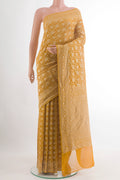 Yellow Banarasi Georgette Saree with Zari Brocade on the body and Zari Border.  displayed on a mannequin