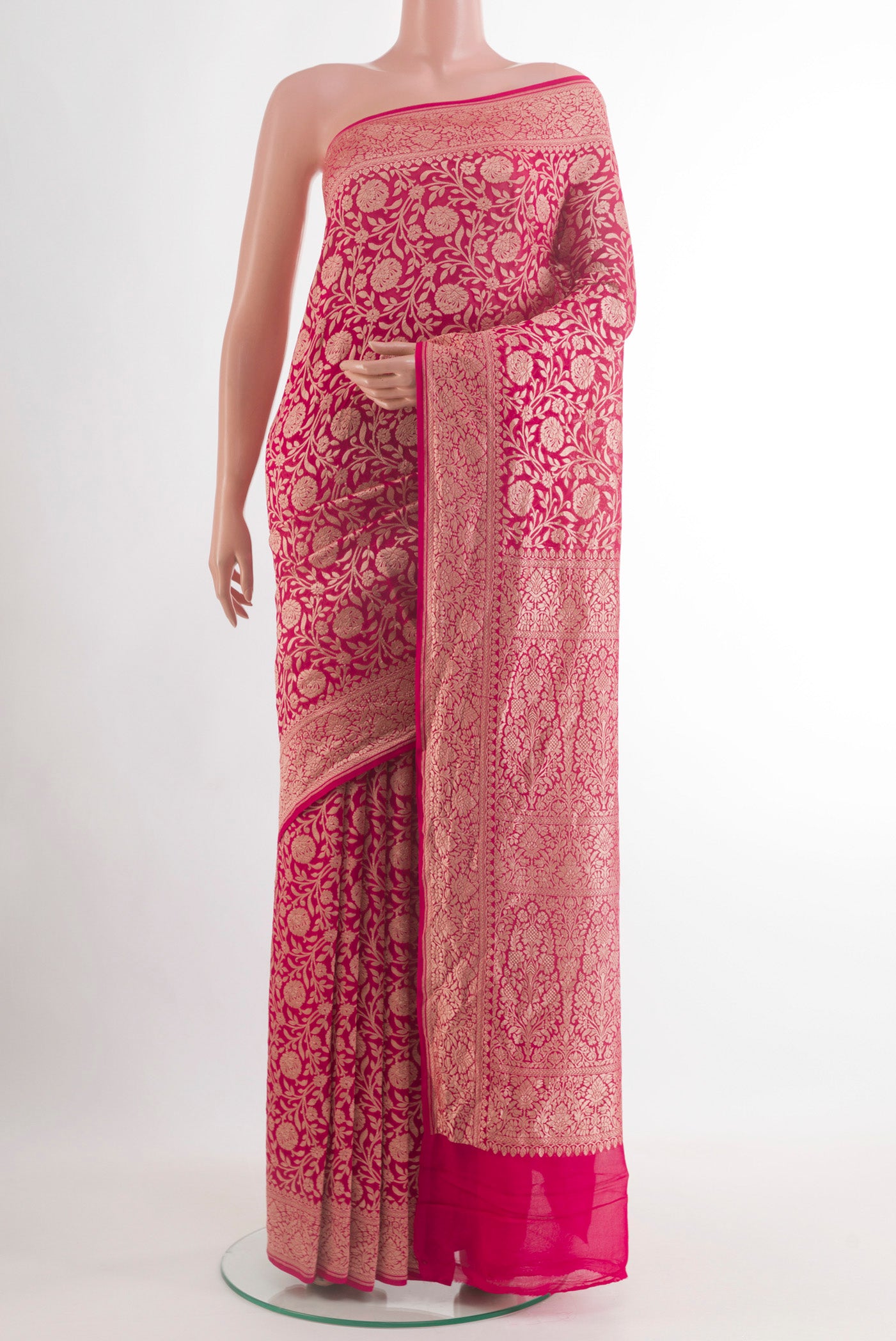 Pink Banarasi Georgette Saree with Zari Brocade on the body and Zari Border.  displayed on a mannequin