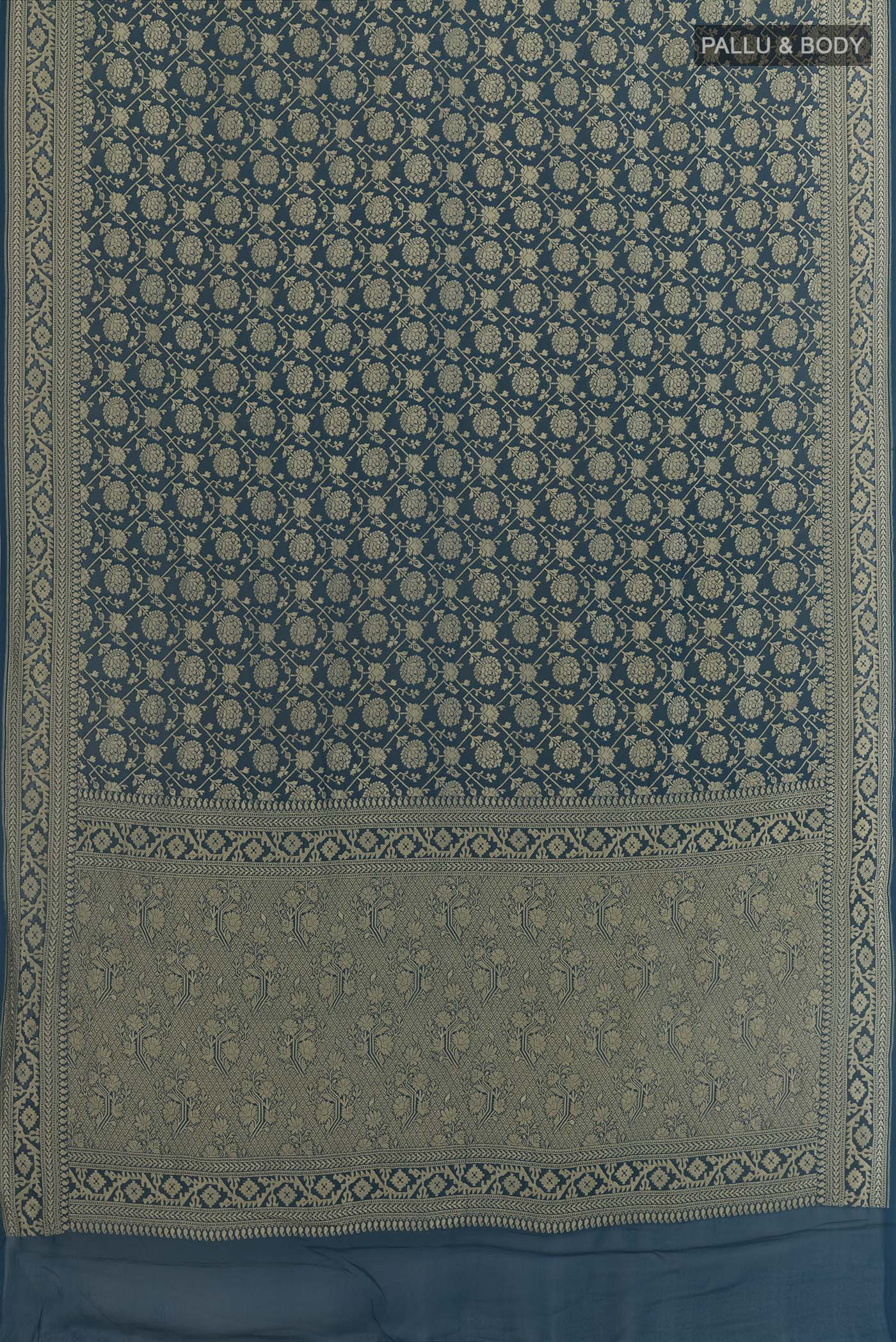 Flat view of Blue Banarasi Georgette Saree with Zari Brocade on the body and Zari Border. 