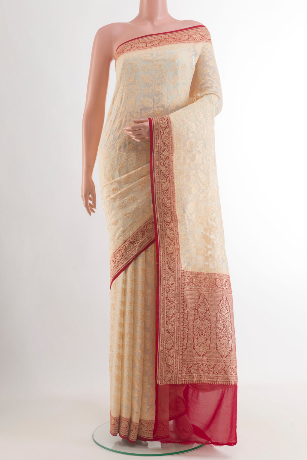 Off White Banarasi Georgette Saree with Zari Brocade on the body and Zari Border.  displayed on a mannequin