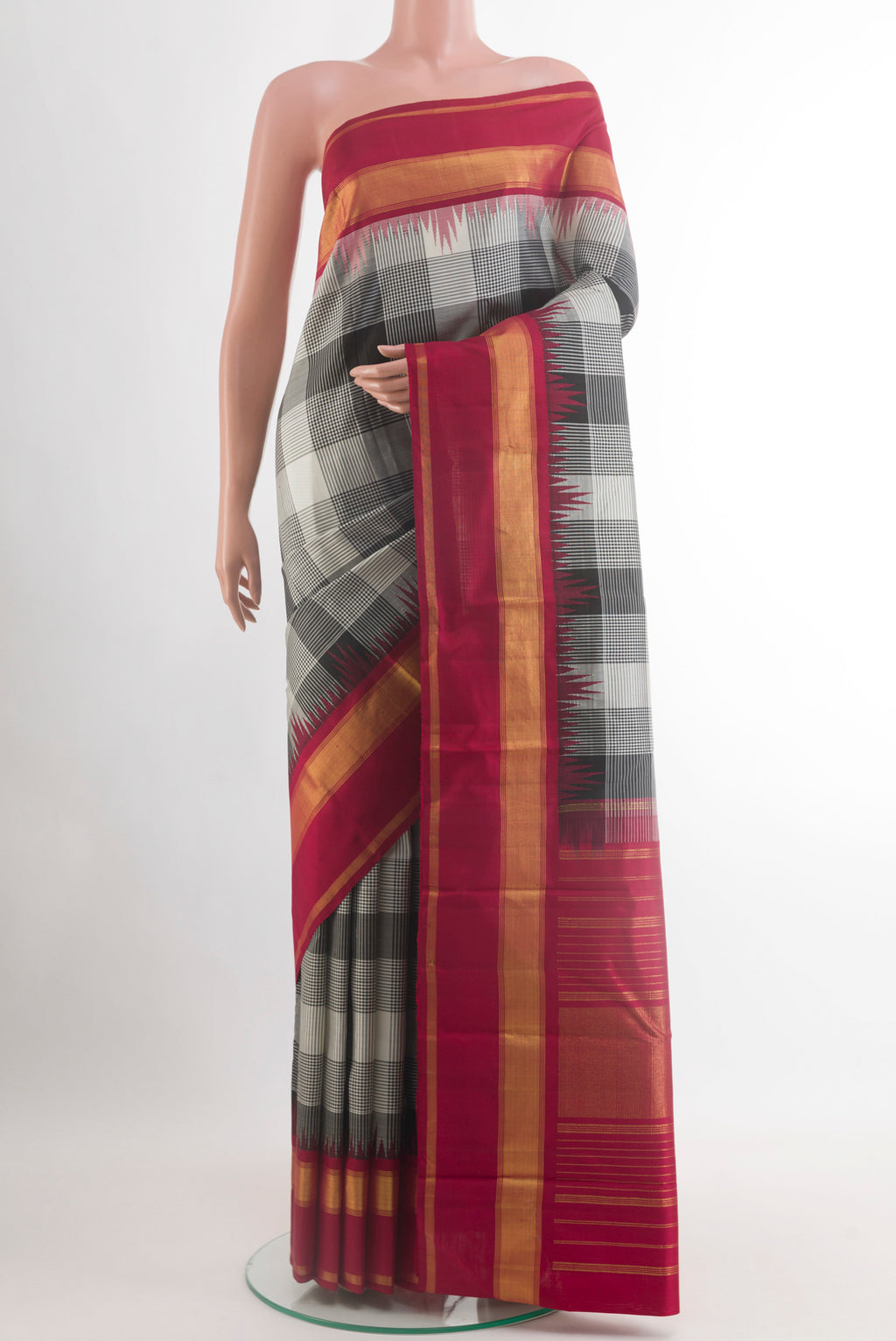 Black Kanjivaram Silk Saree with Checked design on the body and Zari Border.  displayed on a mannequin