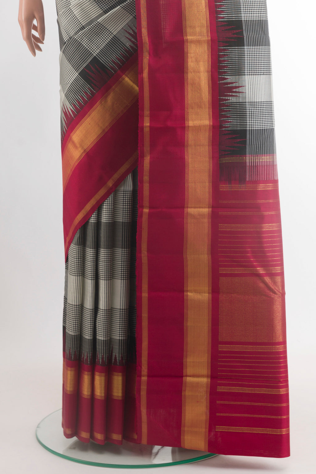 Pleats and pallu of Black Kanjivaram Silk Saree with Checked design on the body and Zari Border. 