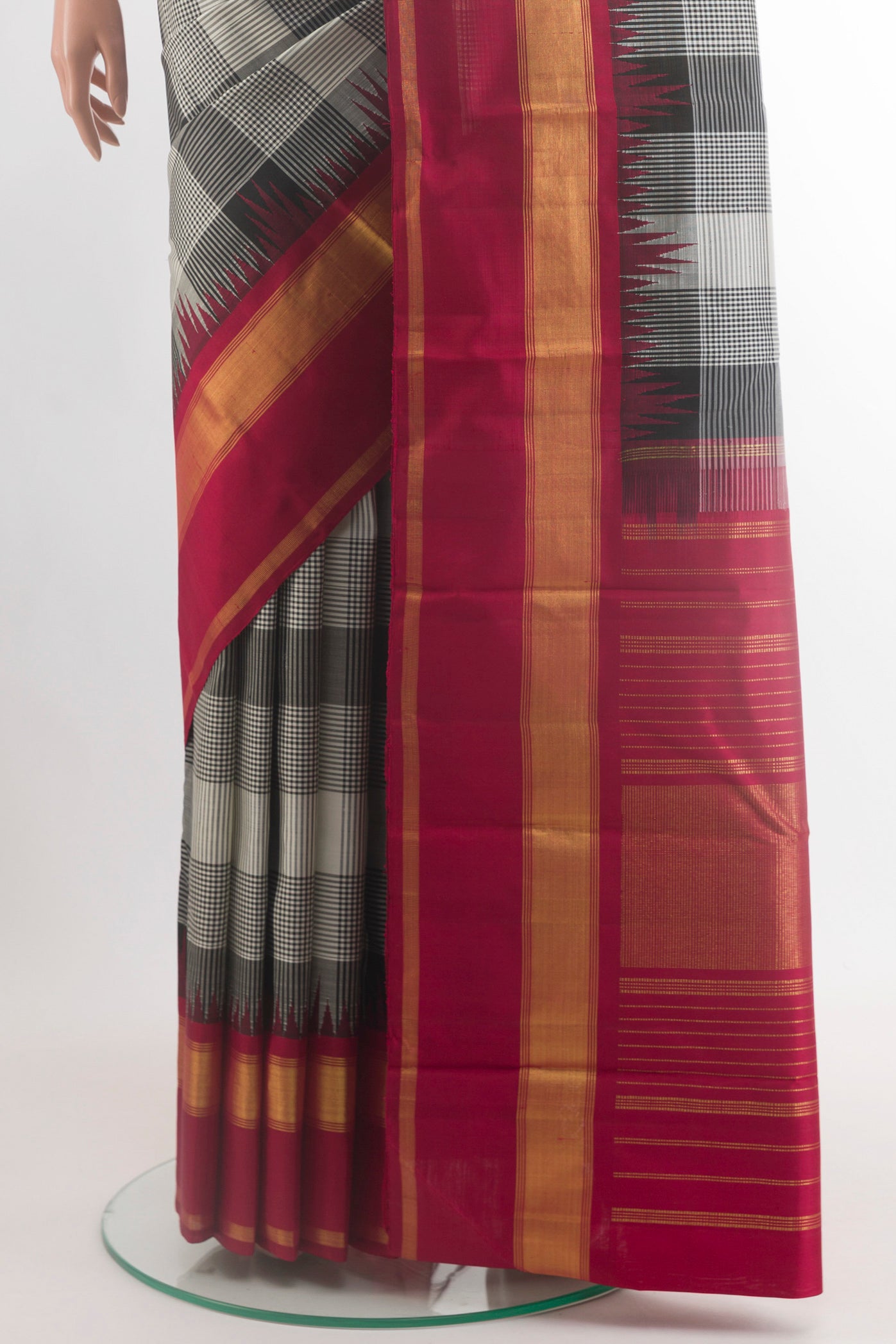 Pleats and pallu of Black Kanjivaram Silk Saree with Checked design on the body and Zari Border. 