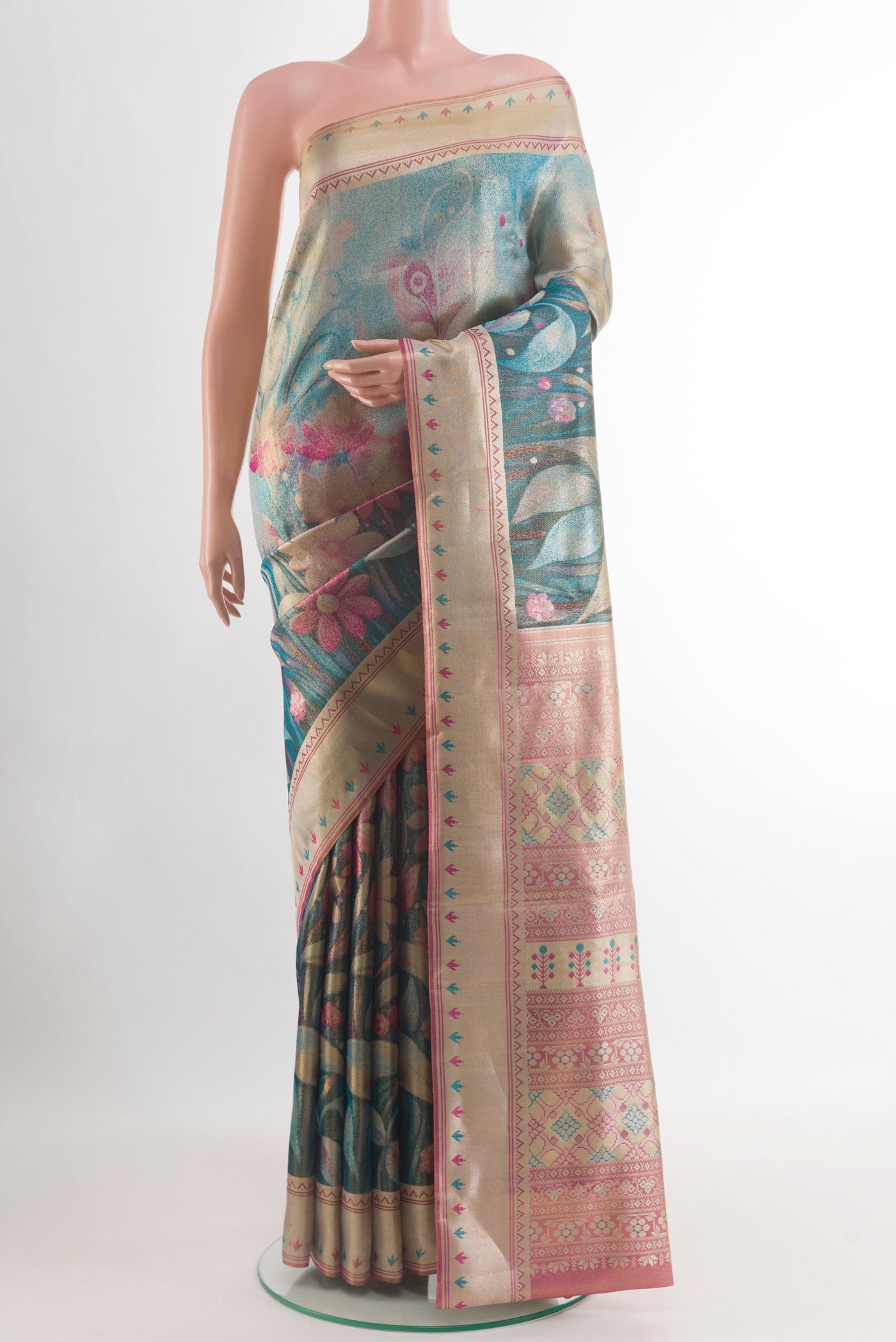 Peacock Blue Kanchipuram Tissue Silk Saree with Zari Brocade on the body and Zari Border.  displayed on a mannequin