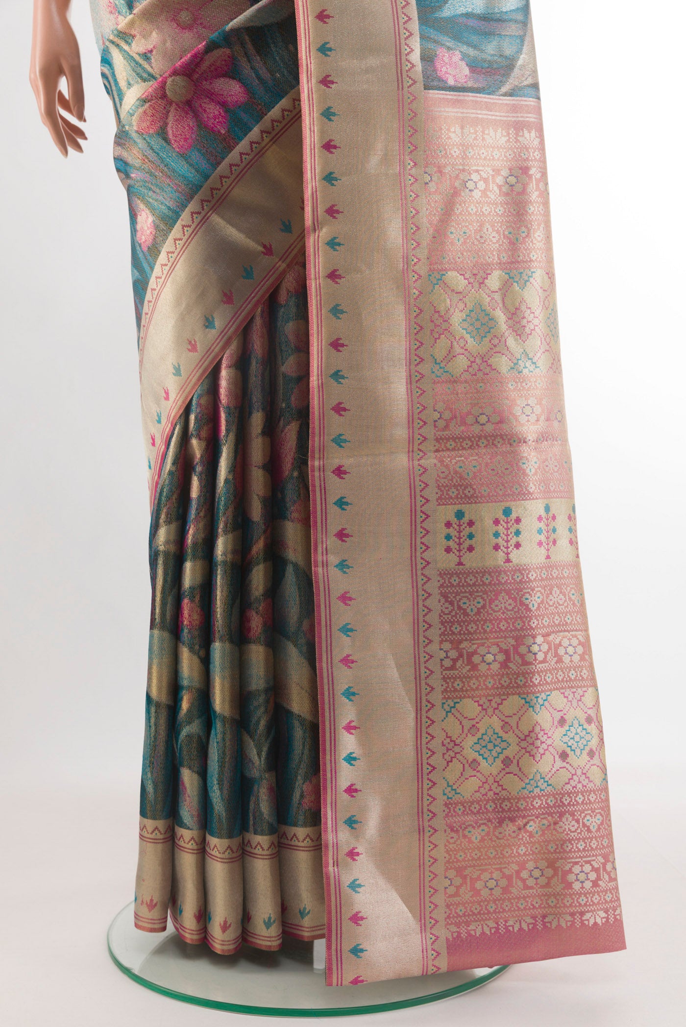 Pleats and pallu of Peacock Blue Kanchipuram Tissue Silk Saree with Zari Brocade on the body and Zari Border. 