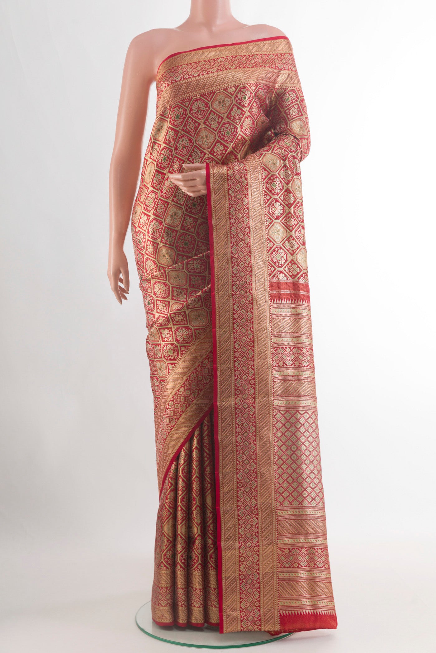 Maroon Kanchipuram Tissue Silk Saree with Zari Brocade on the body and Zari Border.  displayed on a mannequin