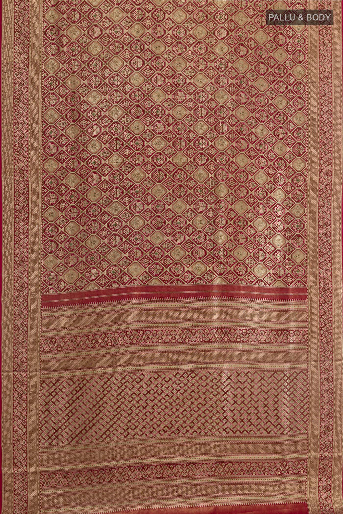 Flat view of Maroon Kanchipuram Tissue Silk Saree with Zari Brocade on the body and Zari Border. 