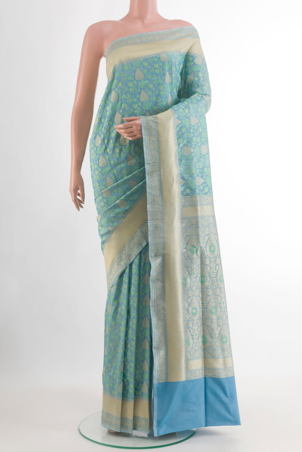 Blue Banarasi Silk Saree with Zari And Thread Butta on the body and Zari Border.  displayed on a mannequin