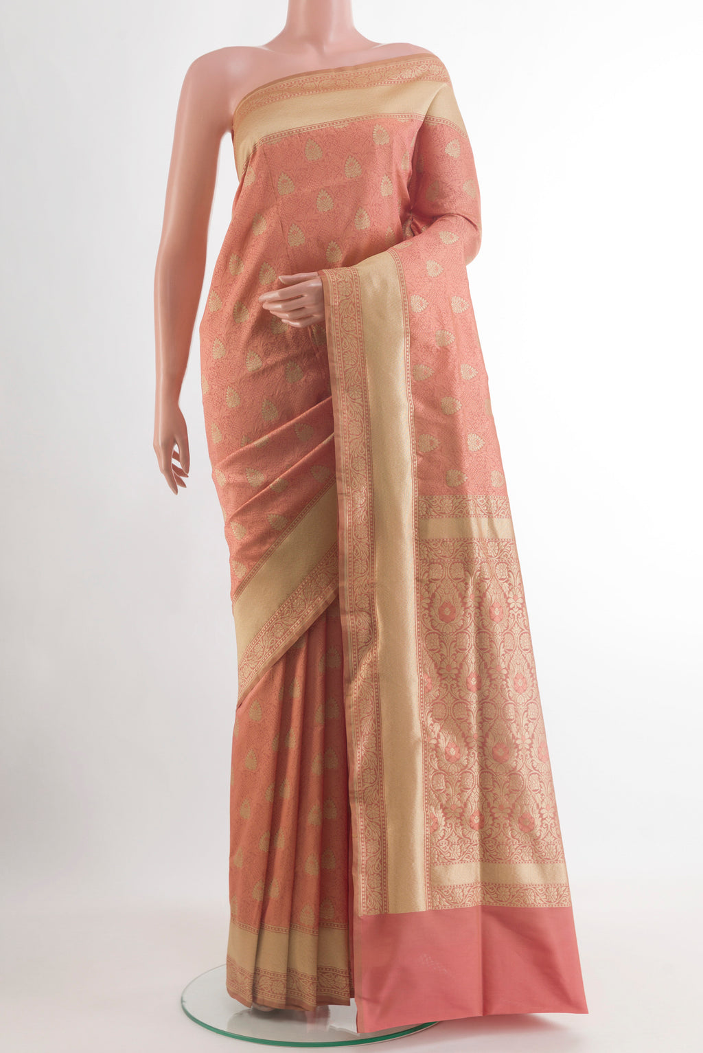Peach Banarasi Silk Saree with Zari And Thread Butta on the body and Zari Border.  displayed on a mannequin