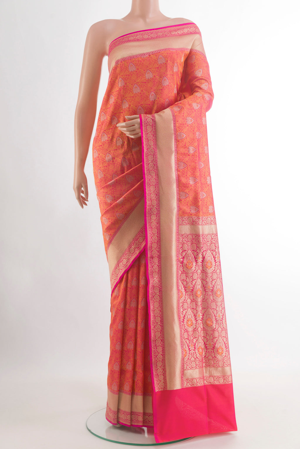 Orange Banarasi Silk Saree with Zari Brocade on the body and Zari Border.  displayed on a mannequin