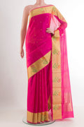 Pink Chanderi Silk Saree with Zari Butta on the body and Zari Border.  displayed on a mannequin